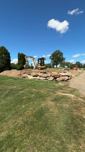 Our retaining wall construction service provides durable and aesthetically pleasing solutions to prevent soil erosion, enhance landscape stability, and create usable outdoor space for your home. Achieve structural integrity with our expert craftsmanship. for Kunkle & Sons Property Maintenance in Akron, OH