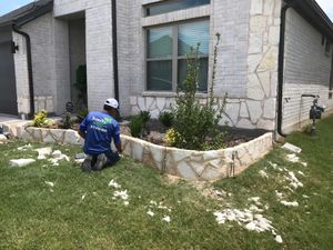 Our Retaining Wall Construction service offers durable, aesthetically pleasing solutions that prevent soil erosion and enhance landscape stability, tailored to complement your home's existing outdoor design for enduring beauty and functionality. for Joandi's Lawn & Landscaping Service in Haltom City, TX