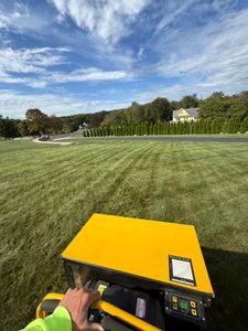 Our mowing service ensures a perfectly manicured lawn with precision cutting, timely schedules, and professional care to enhance your home's curb appeal and maintain a lush, healthy landscape effortlessly. for Navedo’s Lawn Care in Putnam, CT