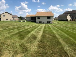 Our Lawn Aeration service helps improve soil structure by creating small holes in your lawn, allowing nutrients, water and oxygen to reach the roots of your grass for healthier and greener growth. for LB's Lawn and Snow, LLC in Saint Cloud, MN