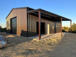 Our Metal Buildings service offers customized, durable structures that combine the functionality of a traditional barn with modern living spaces. Create your dream home or shop with us today! for Bookout Contract Services in Saginaw, TX