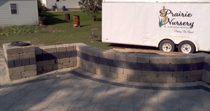 Our Retaining Wall Construction service can help you keep your yard looking neat and tidy by creating a functional wall to hold soil in place. We use quality materials and construction techniques to ensure your retaining wall is durable and long-lasting. for Prairie Landscape in Princeton, IL