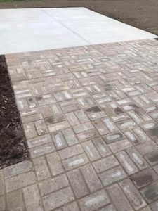 Our Pavers service offers expert installation and maintenance of high-quality paving materials, providing homeowners with durable and aesthetically pleasing driveways, walkways, and outdoor living areas. for Mckay excavating in Saginaw, 