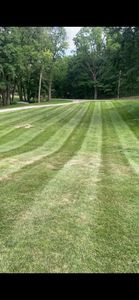 Our Lawn Aeration service enhances grass health by alleviating soil compaction, improving air and water flow, promoting nutrient absorption, and fostering a lush, green lawn for your home's landscape. for Wininger Landscaping in New Richmond, IN