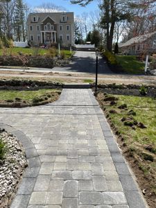 Enhance your home's curb appeal with our expert walkway installation service. We provide durable, aesthetically pleasing walkways, meticulously crafted to complement your landscape and withstand the test of time. for Tk Construction in Gloucester, MA