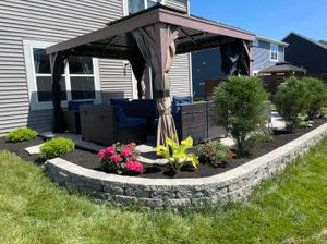 Enhance your outdoor space with our expert retaining wall construction services, designed to prevent soil erosion, increase usable yard area, and add aesthetic value to your landscape effortlessly. for Blue Cardinal Outdoor Living Construction in Kokomo, IN
