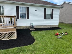 Our Mulch Installation service offers homeowners a convenient and efficient way to improve their garden beds by carefully spreading organic material that nurtures plants and conserves moisture. for Davidson Lawn Care LLC in Greensburg, IN