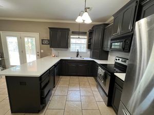 Our Kitchen and Cabinet Refinishing service offers homeowners a cost-effective solution to transform their outdated cabinets into stunning, modern pieces without the need for a full kitchen renovation. for Color Splash Painting in Tulsa, OK