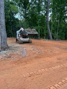 Our Tractor Work service provides homeowners with efficient and professional land clearing, grading, and leveling solutions to enhance the functionality and appearance of their outdoor spaces. for Kerr’s Lawn Care in Salisbury, NC