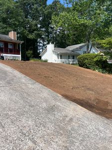 Our grading and drainage service expertly shapes your landscape to prevent water accumulation, protecting your home from potential damage while ensuring a well-drained, stable environment for optimal yard health and beauty. for Adams Landscape Management Group LLC. in Loganville, GA