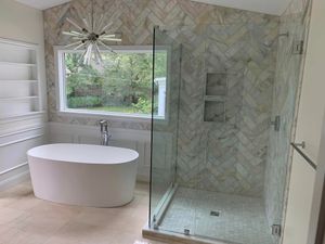 Bathroom remodels enhance aesthetics and functionality, increase property value, and address safety by making repairs and ADA accommodations. for Justin's Tile LLC in Grand Junction, CO