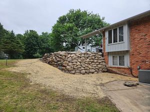 Transform your outdoor space with our expert retaining wall services, designed to prevent soil erosion, enhance aesthetics, and increase structural integrity while seamlessly blending into your landscape's natural beauty. for Howell Hardscape Inc in Brighton, MI