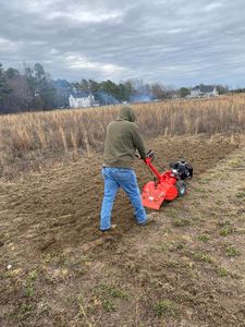 Our tilling service effectively breaks up and aerates soil, allowing for proper water drainage and improved root growth. Let us prepare your garden beds for optimal plant health and growth. for Early Byrd Landscaping & Lawn Care  in Angier, NC