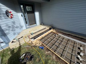 Transform your home with our expert stair design and installation service, featuring durable concrete solutions that blend functionality and style for a stunning, long-lasting addition to any interior or exterior space. for Graham & Schriner Construction in Hinsdale, NH
