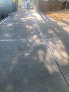 Transform your home's exterior with our expert concrete driveway installation service. Enhance curb appeal and durability, while complementing our comprehensive deck & patio installation offerings for a seamless outdoor experience. for JC’S Flooring Services in Marietta, GA