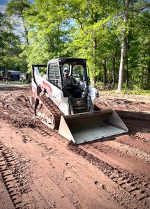 Our grading service ensures your landscape is properly leveled and prepared for any upgrades or construction, achieving a smooth and seamless result in your outdoor space. for Djosey Landscapes in Wilmington, NC