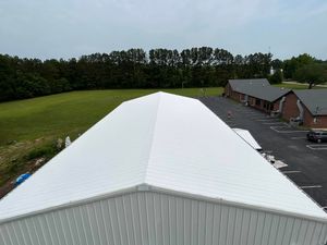 Our Roof Coating service ensures long-lasting protection for your roof against weather elements while enhancing its appearance, providing a cost-effective solution to extend its lifespan. for Soden Paint Collective, LLC in Booneville, MS