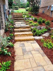 Our Mulch Installation service offers homeowners a convenient and efficient way to enhance the appearance, health, and sustainability of their gardens by applying fresh mulch to protect soil and plants. for Vivid Color Landscapes, LLC in Woodstock, GA