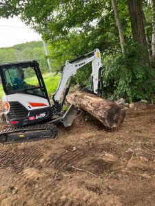 Our Mini Excavator Operation service offers precise and efficient digging for landscaping, plumbing, or foundation work, ensuring minimal disruption to your property while delivering high-quality results tailored to your needs. for LCP Property Management  in Windham, NH