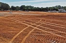 Our Land Grading service efficiently levels your yard, addressing uneven terrain and removing tree stump obstacles to create the perfect foundation for lush landscaping or durable hardscaping installations. for Hidden Springs Enterprise in Rutherford, NC