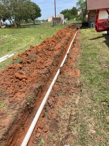 Our Drainage Systems service efficiently manages excess water flow, preventing flooding and foundation damage to your home while maintaining a safe and dry environment in your yard. for Winding Creek Construction & Landscaping in Mcloud, OK