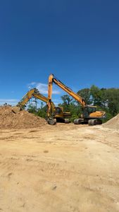 Our Skid Steer Work service provides efficient soil leveling, debris removal, and site preparation to enhance your landscaping projects, ensuring precision and speed for a beautifully transformed outdoor space. for Beards Creek Construction in Grantsboro, NC