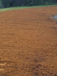 Our Leveling service ensures your land is perfectly prepared for construction, landscaping, or development by using precise equipment to create a stable and even surface that meets your project's needs. for Fisher Hauling And Grading in Rockingham County, NC