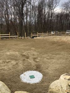Our Land Grading service ensures a level surface, improving drainage and stability, preparing your property for construction or landscaping by removing hills and filling low spots to enhance functionality and aesthetics. for Staruk Trucking & Excavation Inc. in Uxbridge, MA
