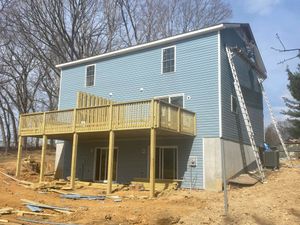 Enhance your outdoor living space with our expert deck & patio installation service, delivering high-quality design and craftsmanship to create the perfect setting for relaxation and entertaining at home. for Cromer Construction & Remodeling in Christiansburg, VA