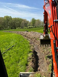 Our trenching service efficiently creates precise trenches for utilities or drainage, ensuring minimal disruption to your property while maintaining safety and quality standards for all your residential excavation needs. for Tri County Enterprises in Benton, PA