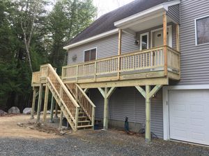 Deck installation is a popular option for homeowners looking to improve their outdoor living space. A well-constructed deck can be a great spot to relax or entertain guests. Our experienced contractors can build a deck that meets your needs and budget. for Jalbert Contracting LLC in Alton, NH