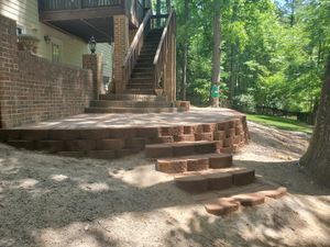 Patio Design & Construction is a service that we offer to help homeowners create the perfect patio for their home. We can design and construct a patio that is perfect for your needs and will add value to your home. for Flori View Landscaping LLC in Durham, NC
