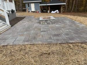 Enhance your outdoor living area with our expertly designed fire pits, perfect for cozy gatherings. Our customizable options blend seamlessly into any landscape, providing warmth and charm to your home. for Alvarez Landscape & Hardscape Service in Rock Hill, SC