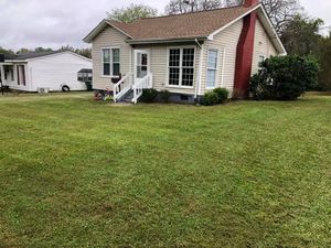 Our Lawn Aeration service helps improve air and water circulation in your soil, resulting in healthier roots, reduced thatch buildup, and a greener and lusher lawn. for Early Byrd Landscaping & Lawn Care  in Angier, NC