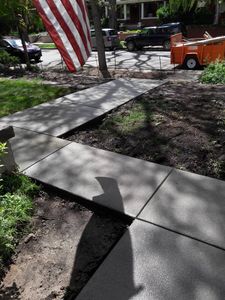 Transform your outdoors with our professional sidewalk installation service. We ensure durable, attractive walkways tailored to enhance your home's curb appeal and functionality, using high-quality concrete and expert craftsmanship. for Tiny Concrete & Fence Installs in Aurora, CO