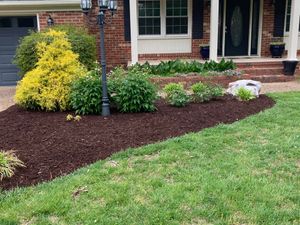 Our Mulch Installation service is designed to enhance the aesthetics of your outdoor space by spreading a layer of organic material over the soil, providing benefits such as weed suppression and moisture retention. for Three Brothers Lawn & Landscaping LLC in Yorktown, VA