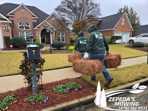 Enhance your home's curb appeal with our professional pinestraw installation service, providing a clean, natural look to your landscape while artistically complementing the surroundings for a cohesive and beautiful outdoor space. for Zepeda's Mowing in Fort Valley, GA
