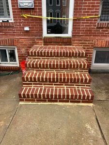 Our Step Installation service ensures durable, safe, and aesthetically pleasing entrance steps for your home. Our expert masons work with precision using high-quality materials to enhance both functionality and curb appeal. for Davey's Masonry & Concrete LLC in Baltimore, Maryland