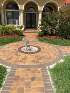 Walkways is a service that allows homeowners to design and customize their own walkway using pavers. This service is unique because it allows homeowners to be creative and choose the colors, shapes, and sizes of their walkway. for Fafa's Omega Brick Pavers in Lakeland, FL