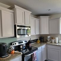 Our Kitchen and Cabinet Refinishing service can give your cabinets a brand new look! We offer a wide variety of finishes to choose from, so you're sure to find the perfect one for your home. for Hunter Painting LLC in IA · Runnells, IA · Norwalk