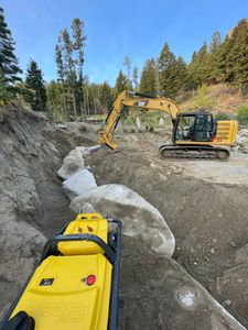 Our Retaining Walls service provides durable and aesthetically pleasing solutions to stabilize your landscape, prevent soil erosion, and enhance your outdoor space with expertly crafted designs tailored to meet your property's needs. for Dig in Dirt Works in Clancy, MT