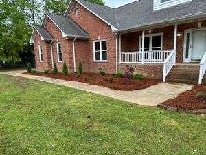 Our Mulch Installation service offers homeowners the convenience of professionally spreading mulch to protect their garden beds, enhance curb appeal, and promote healthy plant growth. for Young’s Landscaping and Maintenance  in Jasper,  AL