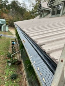 Our gutter and guard installation service is a great way to keep your gutters clean and functioning properly. We can install a variety of different types of guards to help keep debris out of your gutters, which will prevent clogs and improve water flow. for AmeriClean Power Washing Services in Gainesville, GA