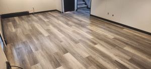 Our flooring installation service offers professional and efficient installation of various flooring types, ensuring a seamless and high-quality finish for your home. for Cut a Rug Flooring Installation in Lake Orion, MI