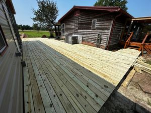 Our Deck & Patio Installation service offers professional assistance to homeowners looking to enhance their outdoor living spaces with custom and high-quality decks or patios. for Simmons Construction in Starkville, MS