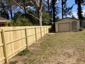 Our Wood Fencing service offers high-quality, durable and aesthetically pleasing wooden fences that provide privacy, security and enhance the overall appearance of your property. for Sea Level Fence in Virginia Beach, VA