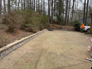 Transform your home's entrance with our driveway design & build service, offering custom solutions that combine aesthetics and functionality to enhance curb appeal while providing durable, high-quality craftsmanship. for Lewis Oaks Landscaping in King and Queen County, VA