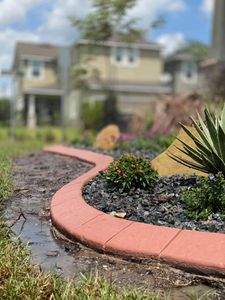 Enhance your landscape with our durable and stylish concrete curbing, providing a seamless edge for lawns and gardens while increasing curb appeal and complementing your home's outdoor aesthetic. for King Kutz Landscaping in Apopka, FL