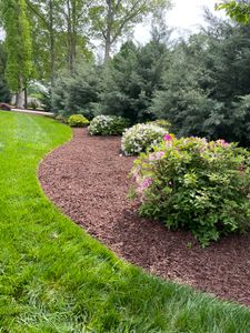 Our Mulch Installation service offers homeowners a convenient and professional solution to enhance their landscape by spreading mulch, improving soil health, weed prevention, and adding aesthetic appeal. for DLS Landscaping in Charlotte, NC