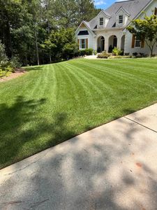 Our professional mowing service will keep your lawn neat and healthy, providing consistent maintenance for a lush green yard that enhances the beauty and value of your home. for Sanders Landscape & Maintenance in McDonough, GA